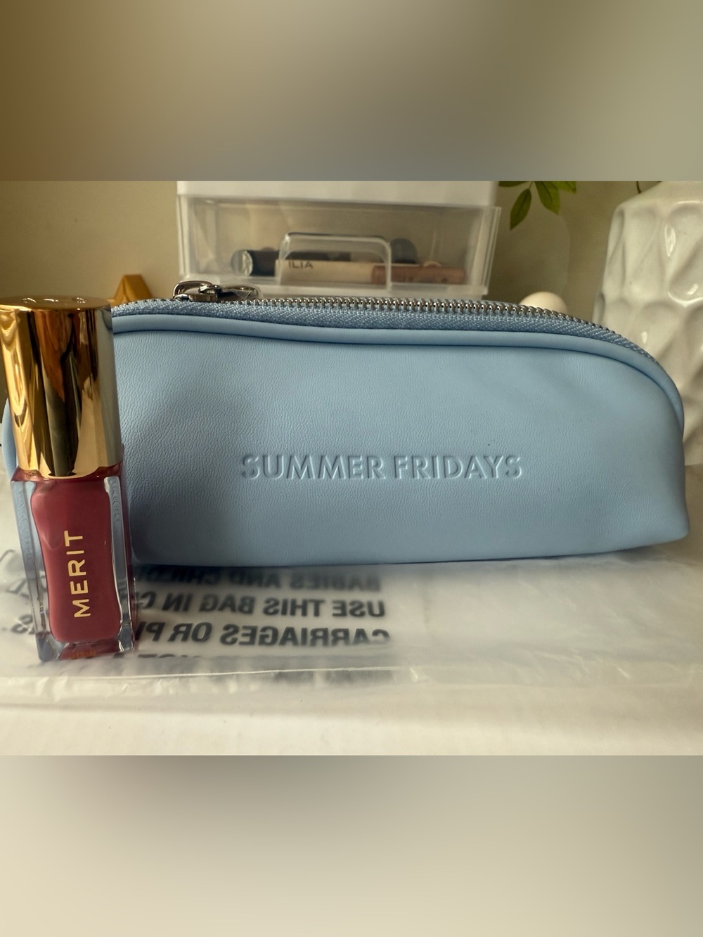 Summer Fridays Powder Blue Embossed Makeup Case And Merit Lip oil